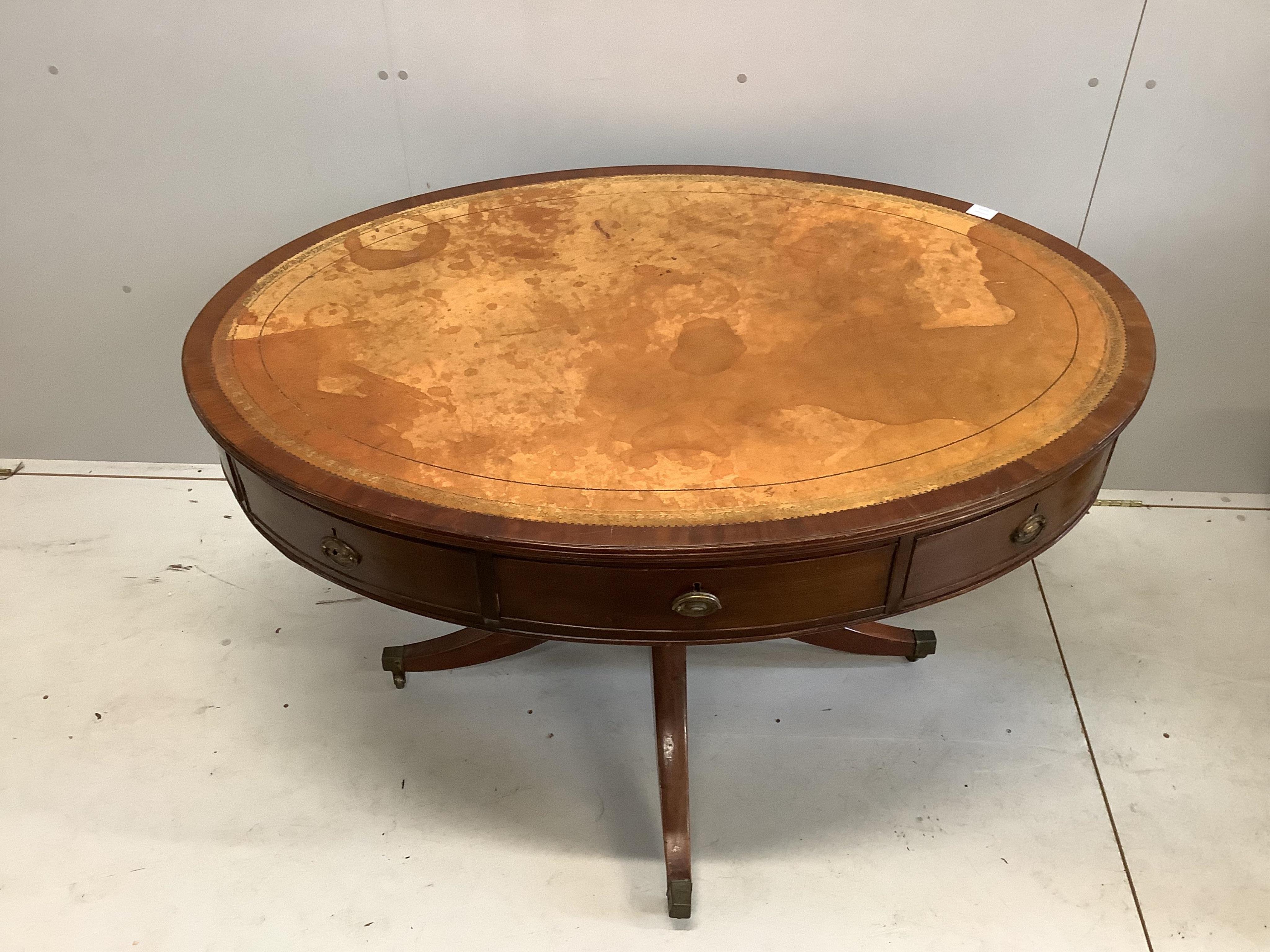 A Regency oval mahogany drum table, width 122cm, depth 94cm, height 76cm. Condition - fair